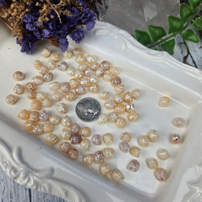 Carved Pearl Skulls