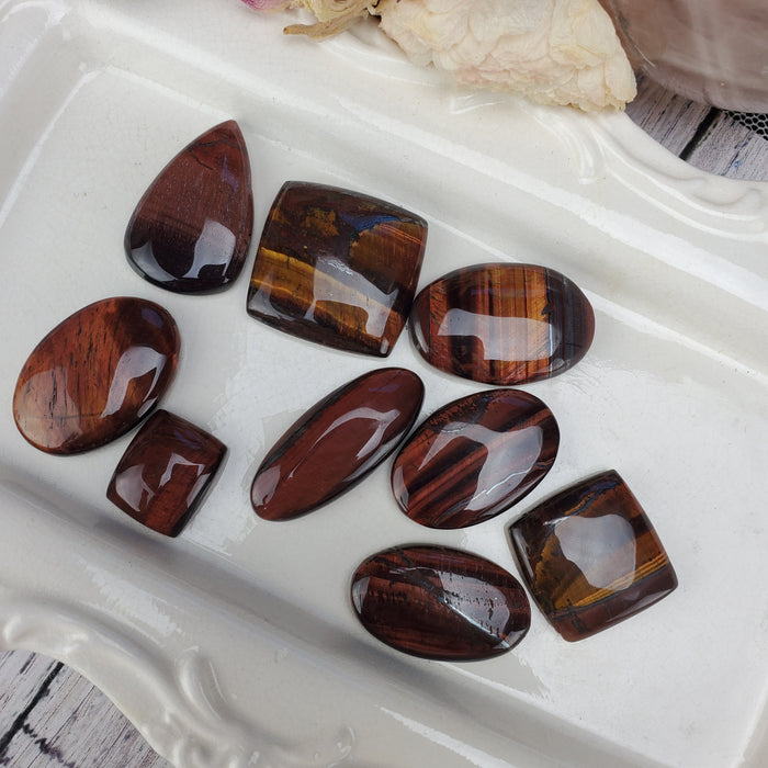 Red Tigers Eye Cabochons, 100 gram bags